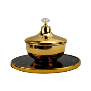 stainless steel golden cookie jar with black wooden tray as base